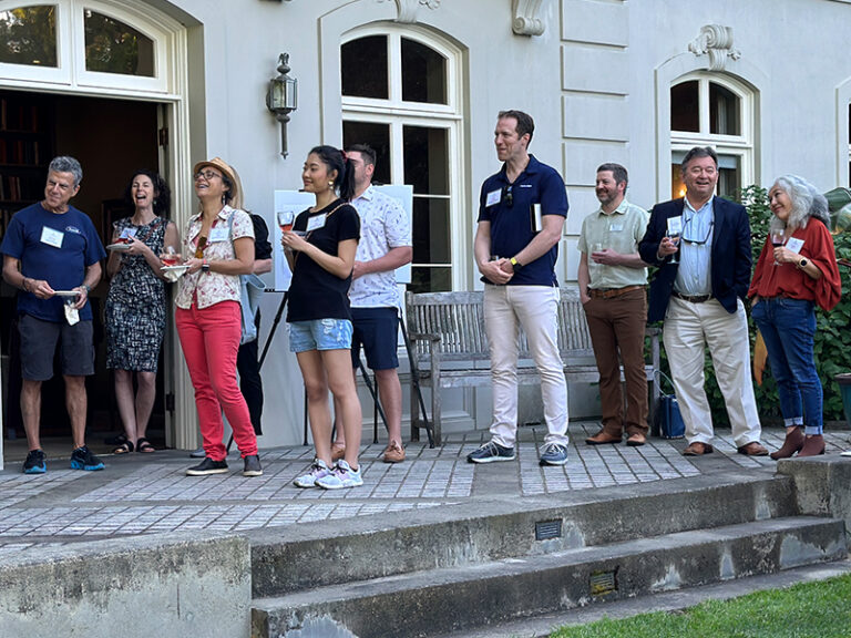 Chamber After Hours attendees on the steps of the main residence at Bloedel Reserve